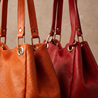 Bolsas Serena de piel Floater en Naranja y Rojo, edición Tonos Vibrantes